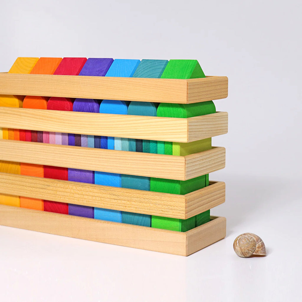Colorful wooden blocks stacked on a white background