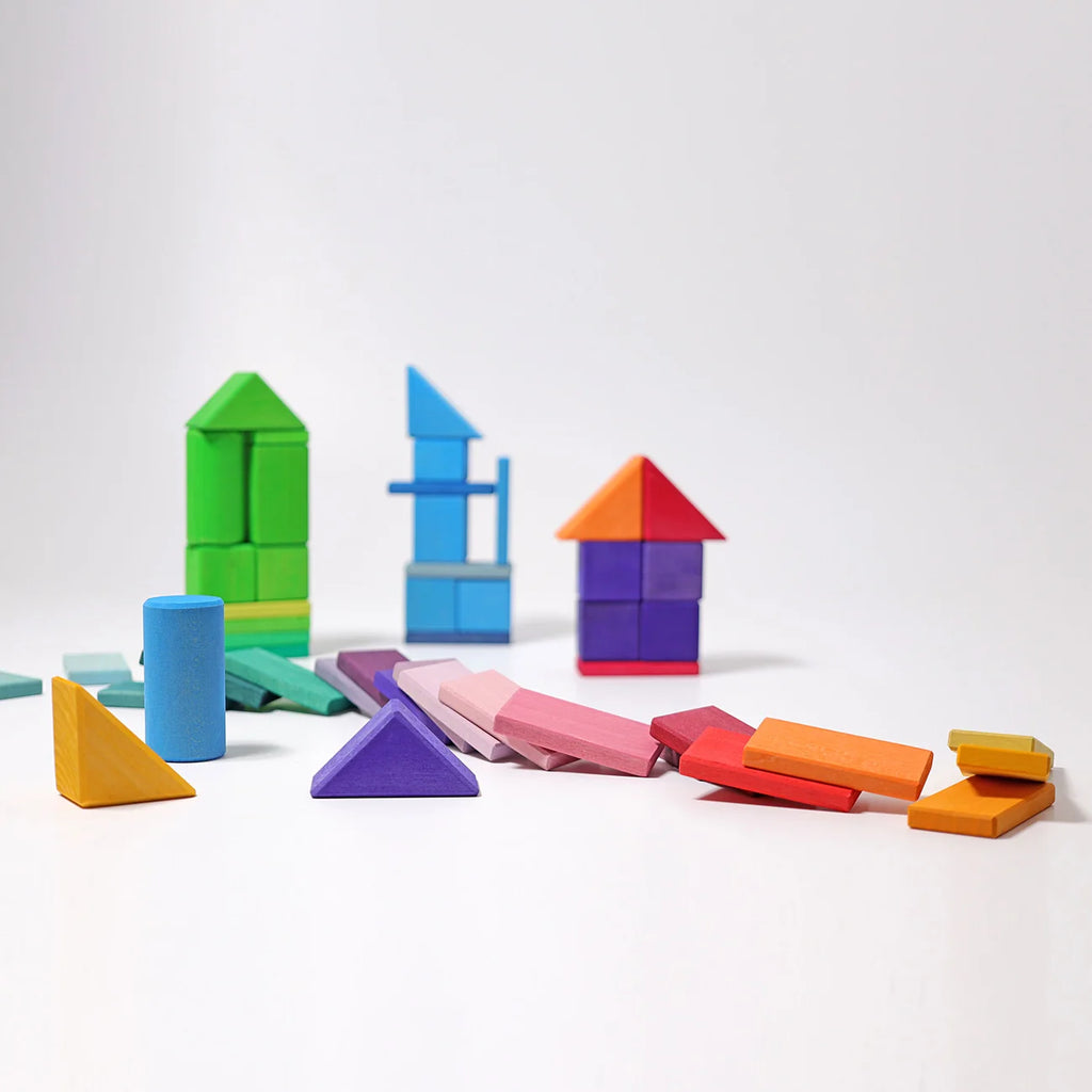 Colorful geometric building blocks on a white background