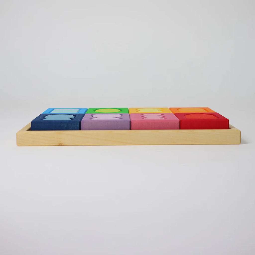 Colorful wooden blocks on a light gray background