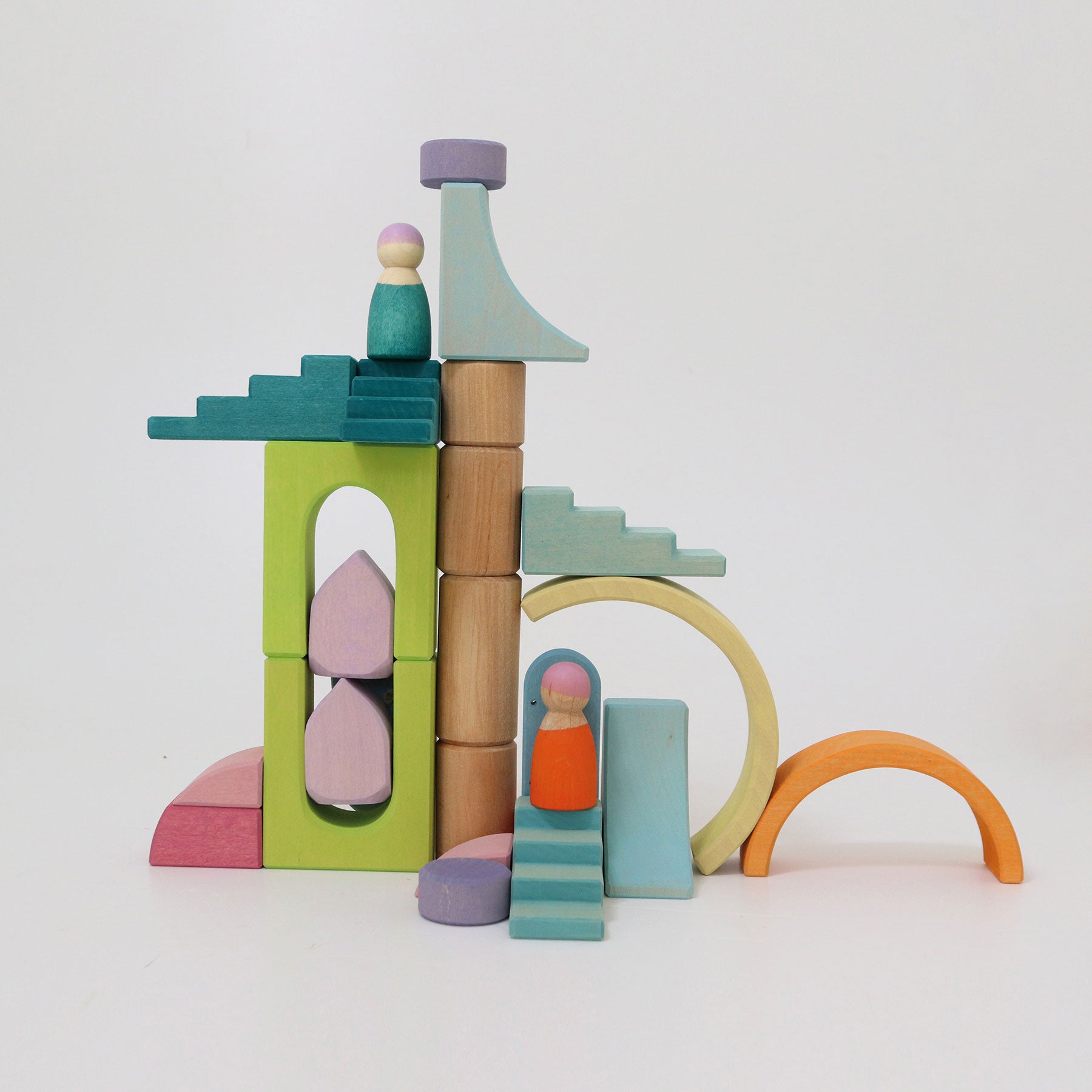 Colorful wooden block set resembling a castle on a white background