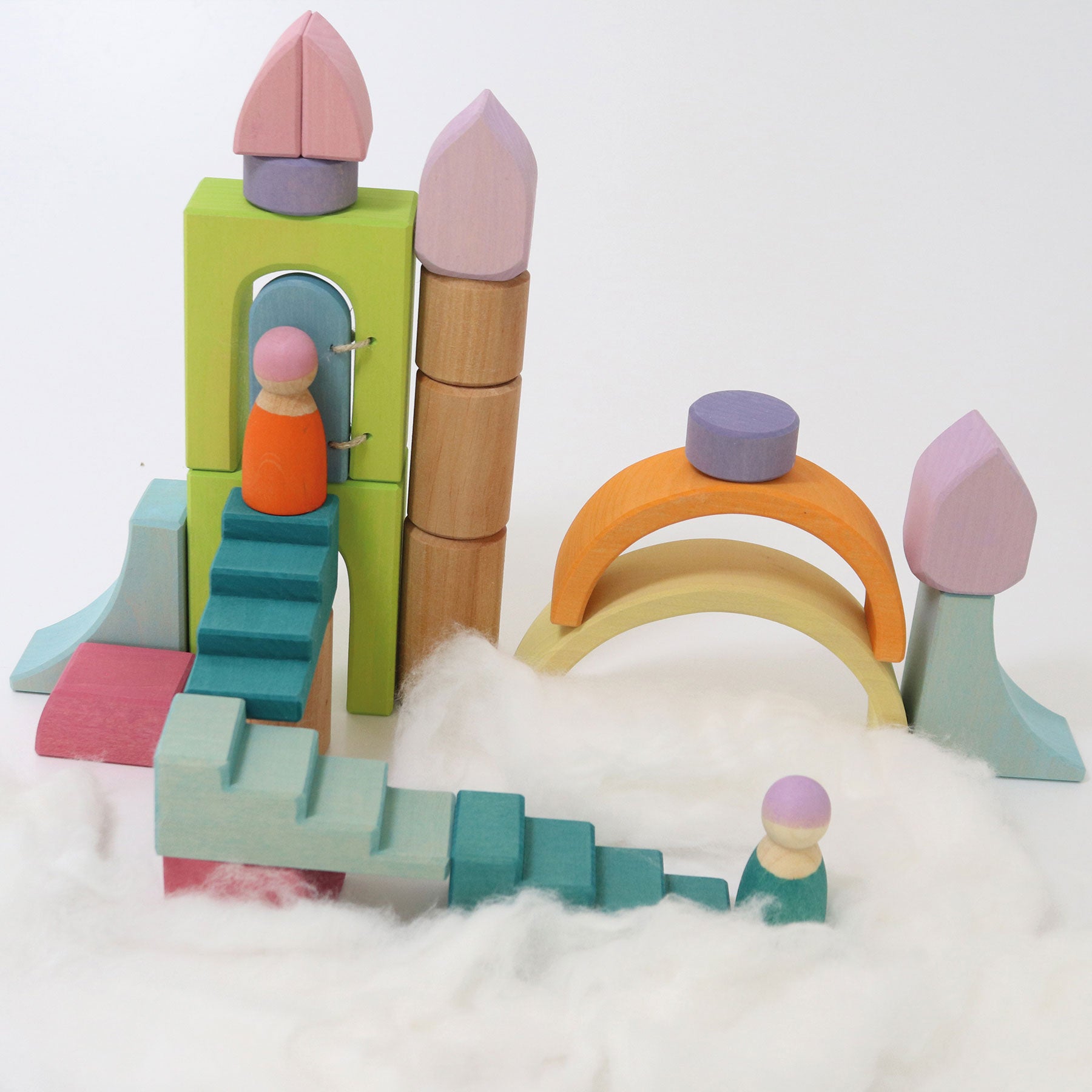 Colorful wooden toy set with small figures on a white background