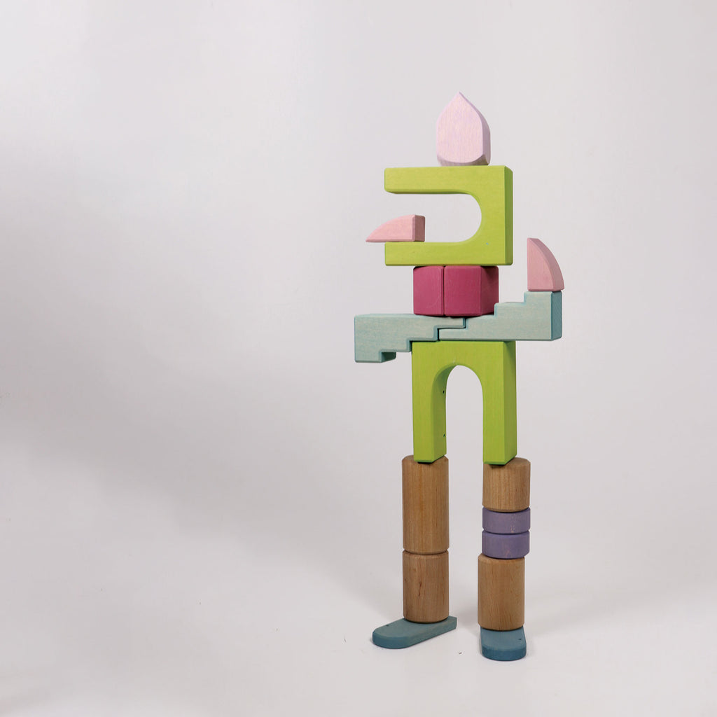 Colorful wooden toy figure on a white background