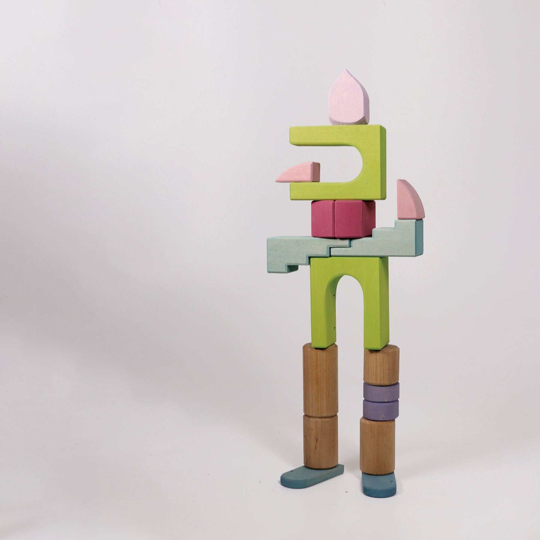 Colorful wooden toy figure on a white background