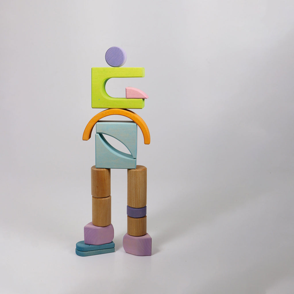 Colorful wooden block sculpture on a white background