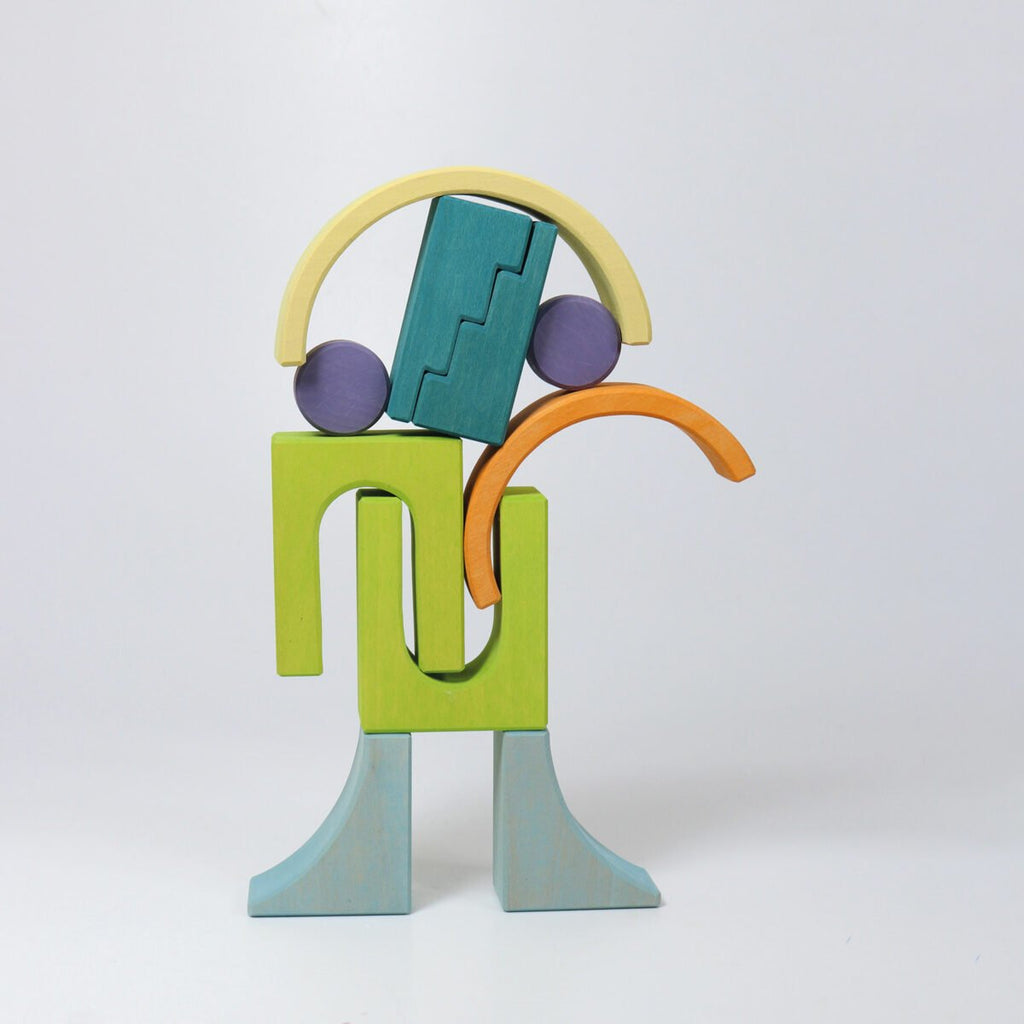 Colorful wooden toy figure on a white background