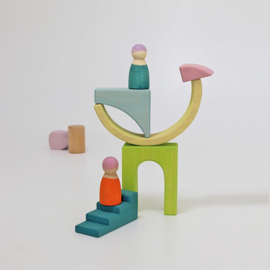 Colorful wooden toy set on a white background