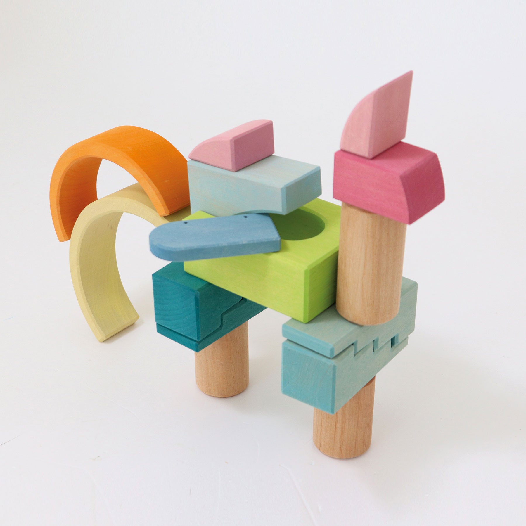 Colorful wooden building blocks on a white background