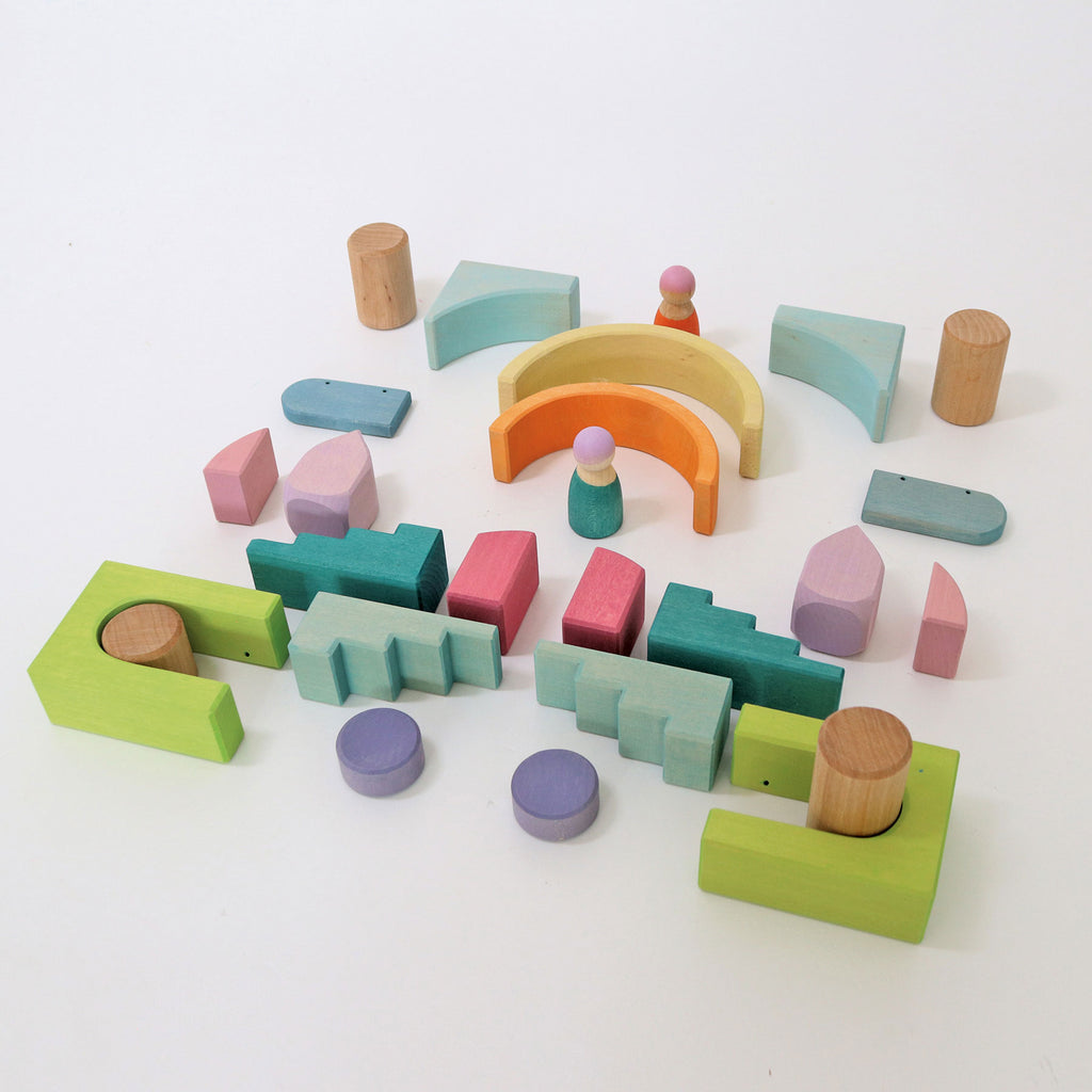 Colorful wooden building blocks on a white background