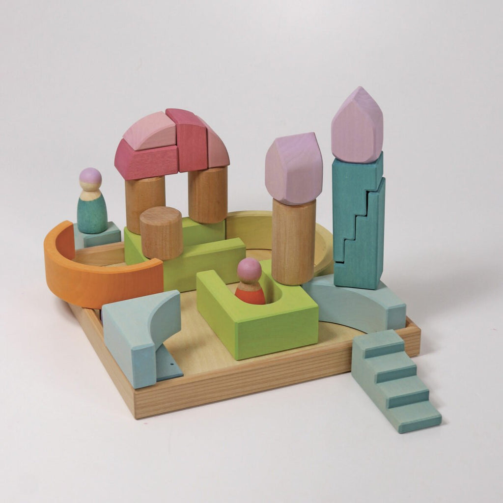 Colorful wooden toy set on a white background