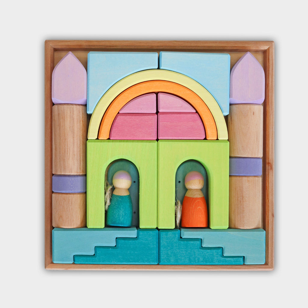Colorful wooden toy set with arches and figures on a white background