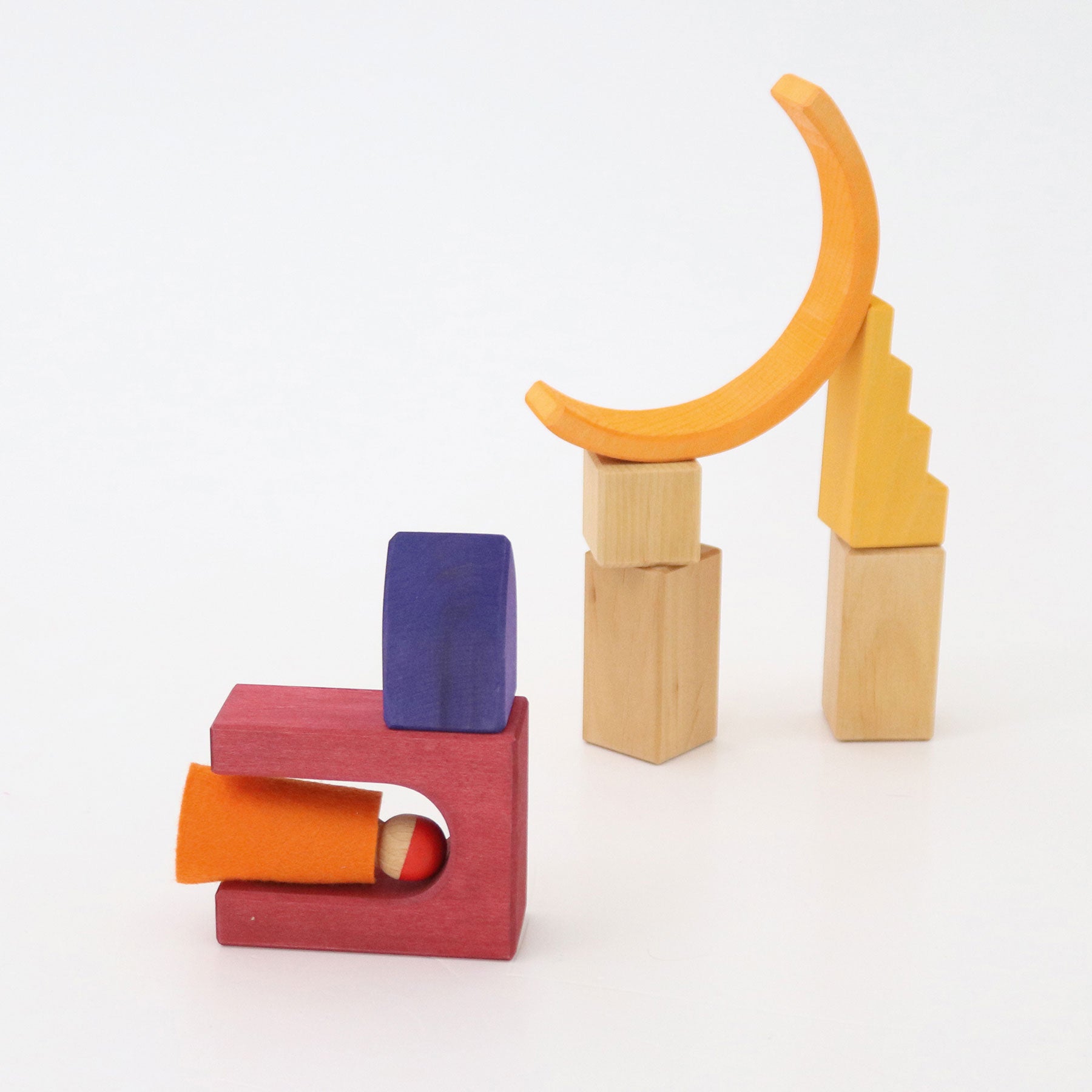 Colorful wooden blocks arranged in a playful manner on a white background