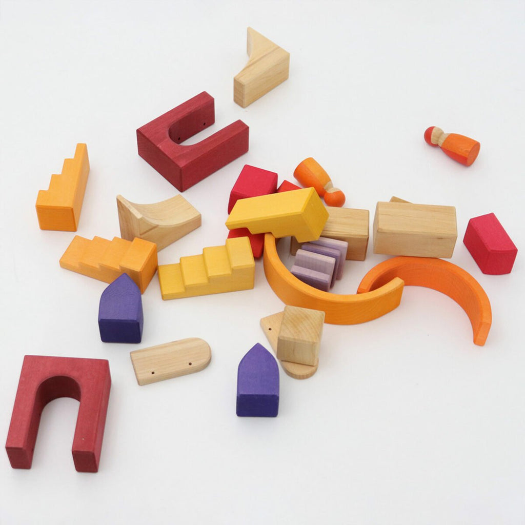 Colorful wooden building blocks on a white background