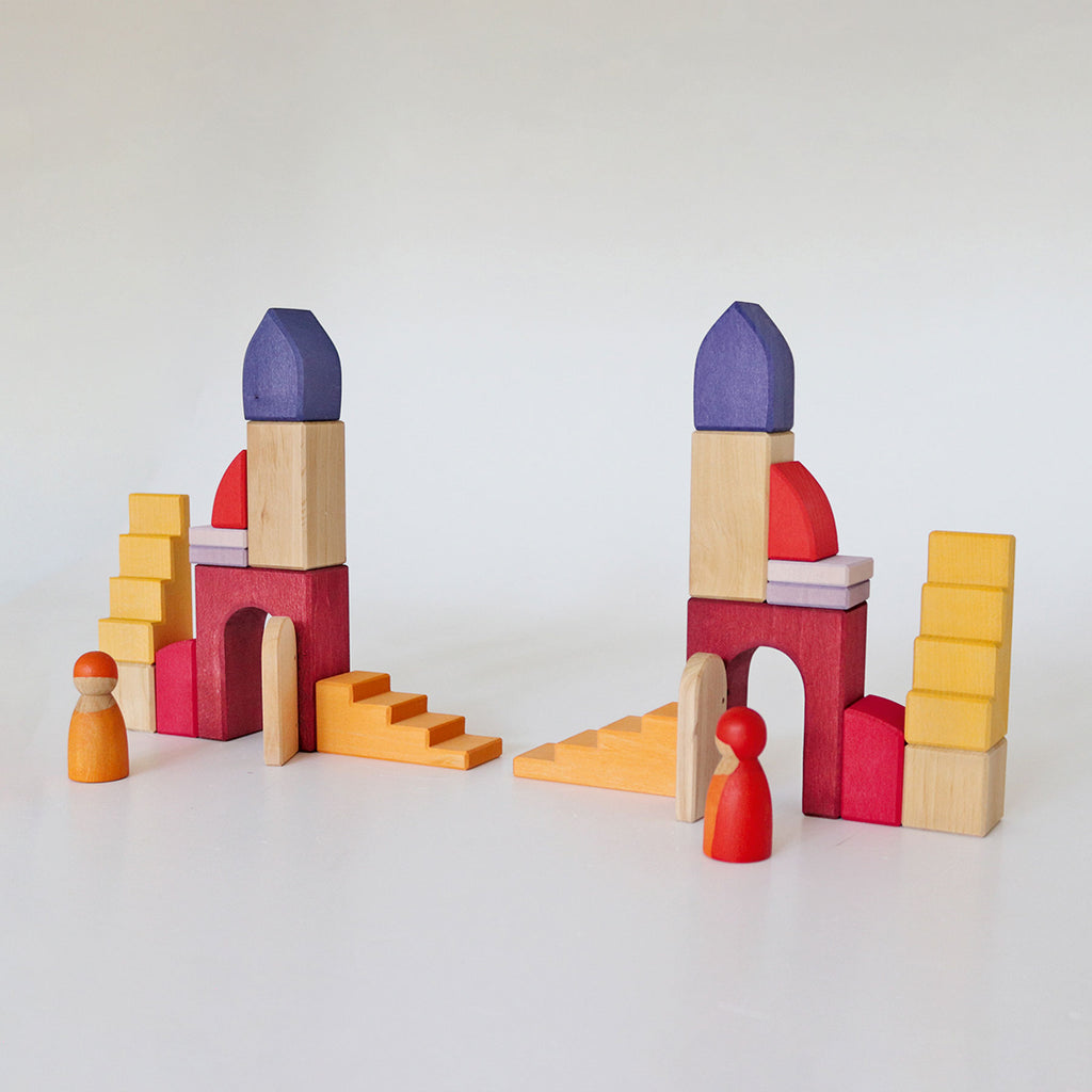 Colorful wooden building blocks on a white background