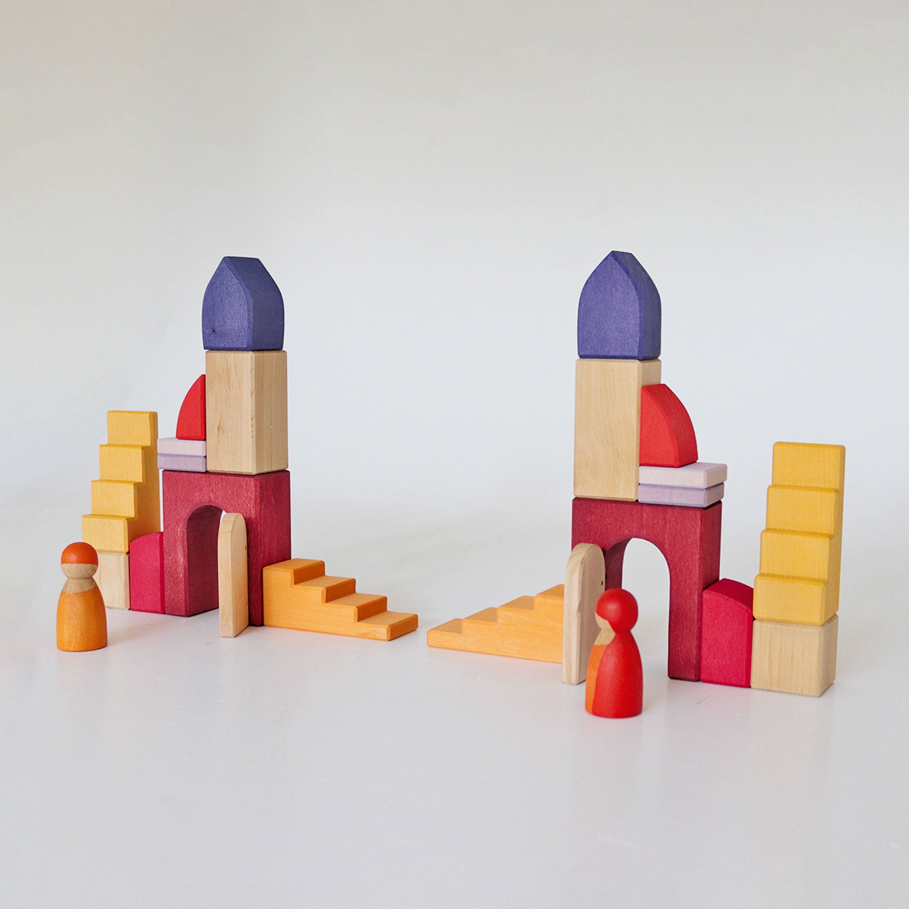 Colorful wooden building blocks on a white background