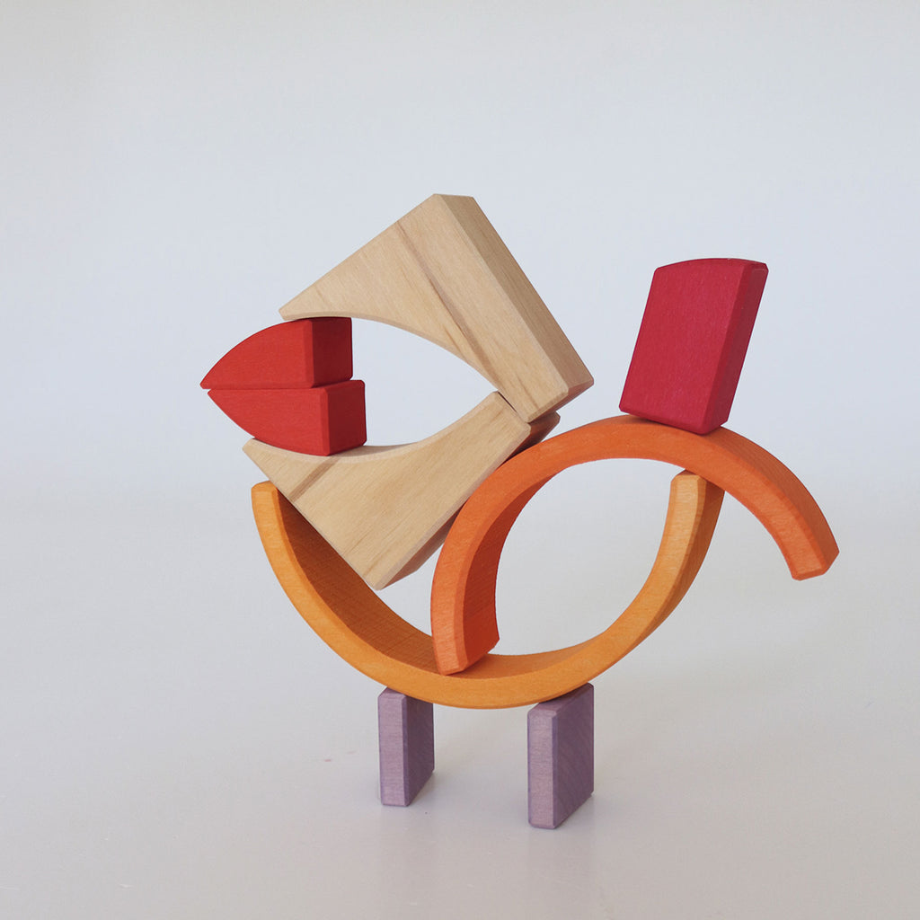 Colorful wooden sculpture on a white background