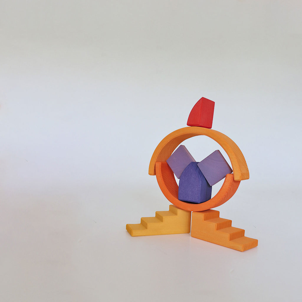 Colorful geometric toy structure on a white background