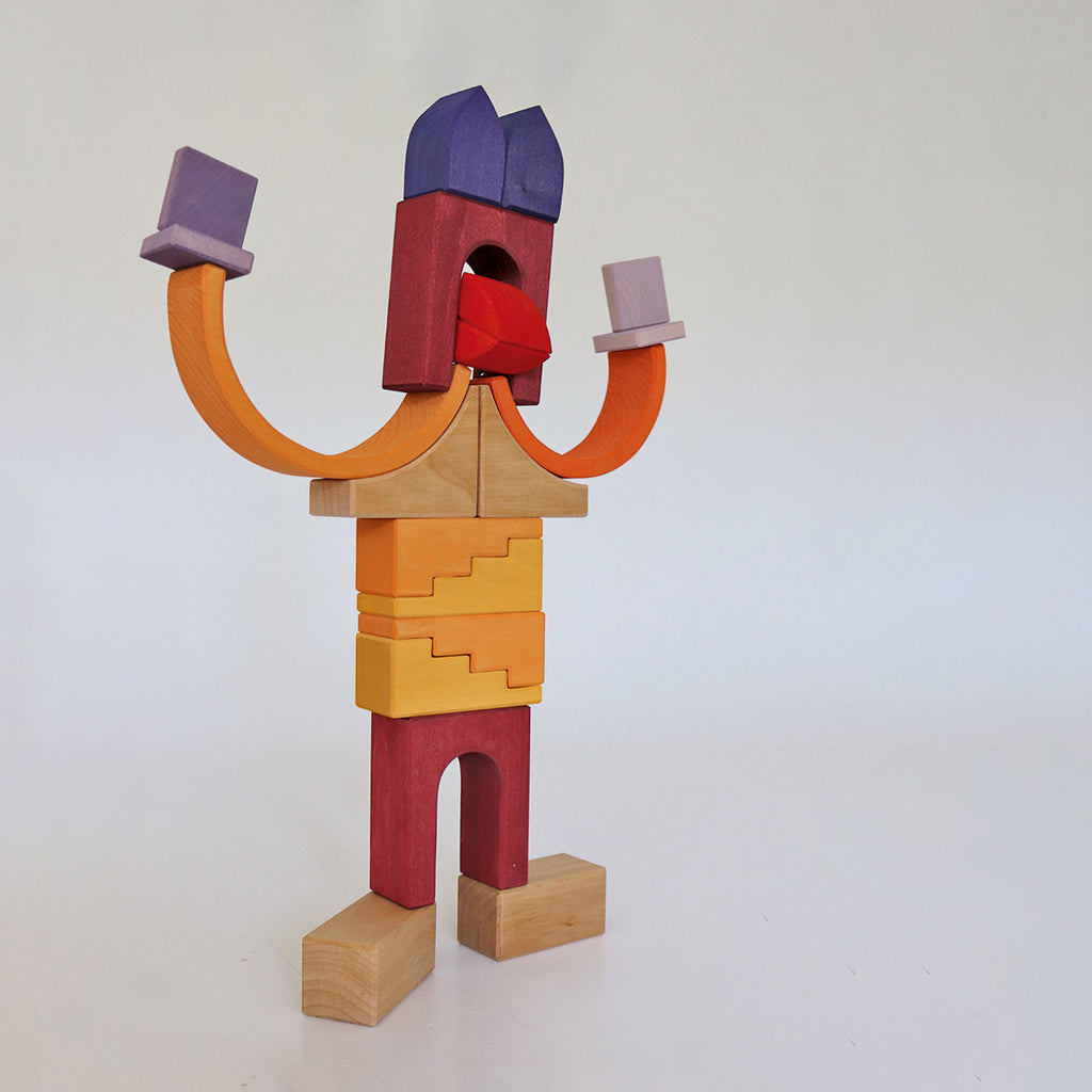 Colorful wooden block sculpture on a white background