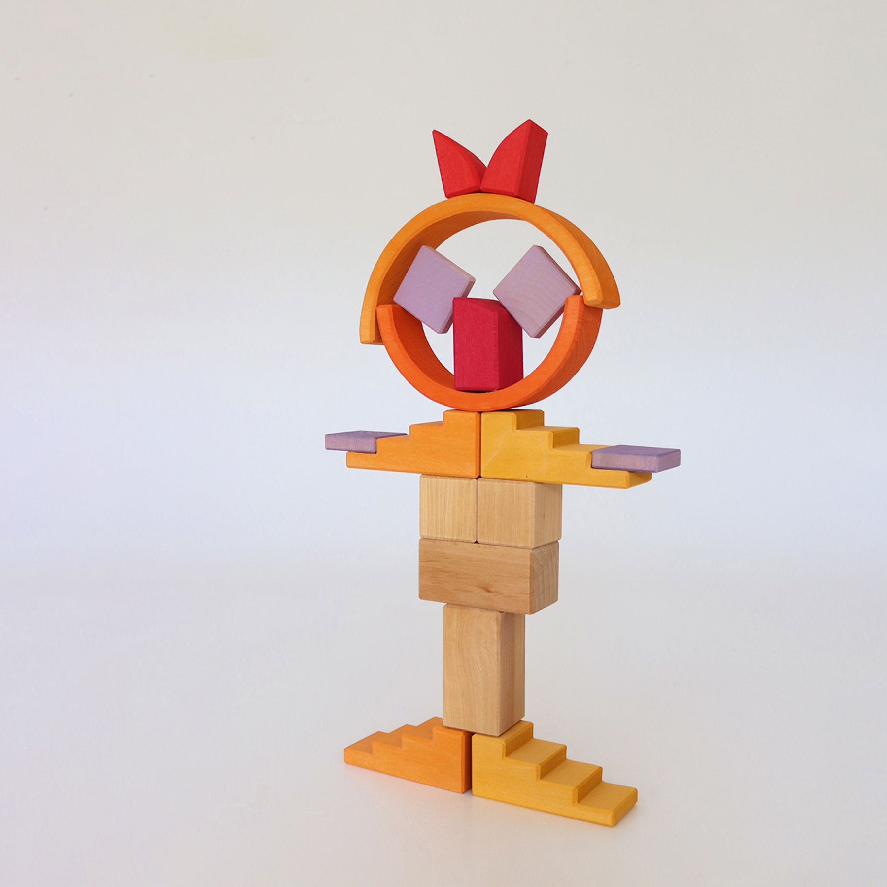 Colorful wooden block sculpture on a white background