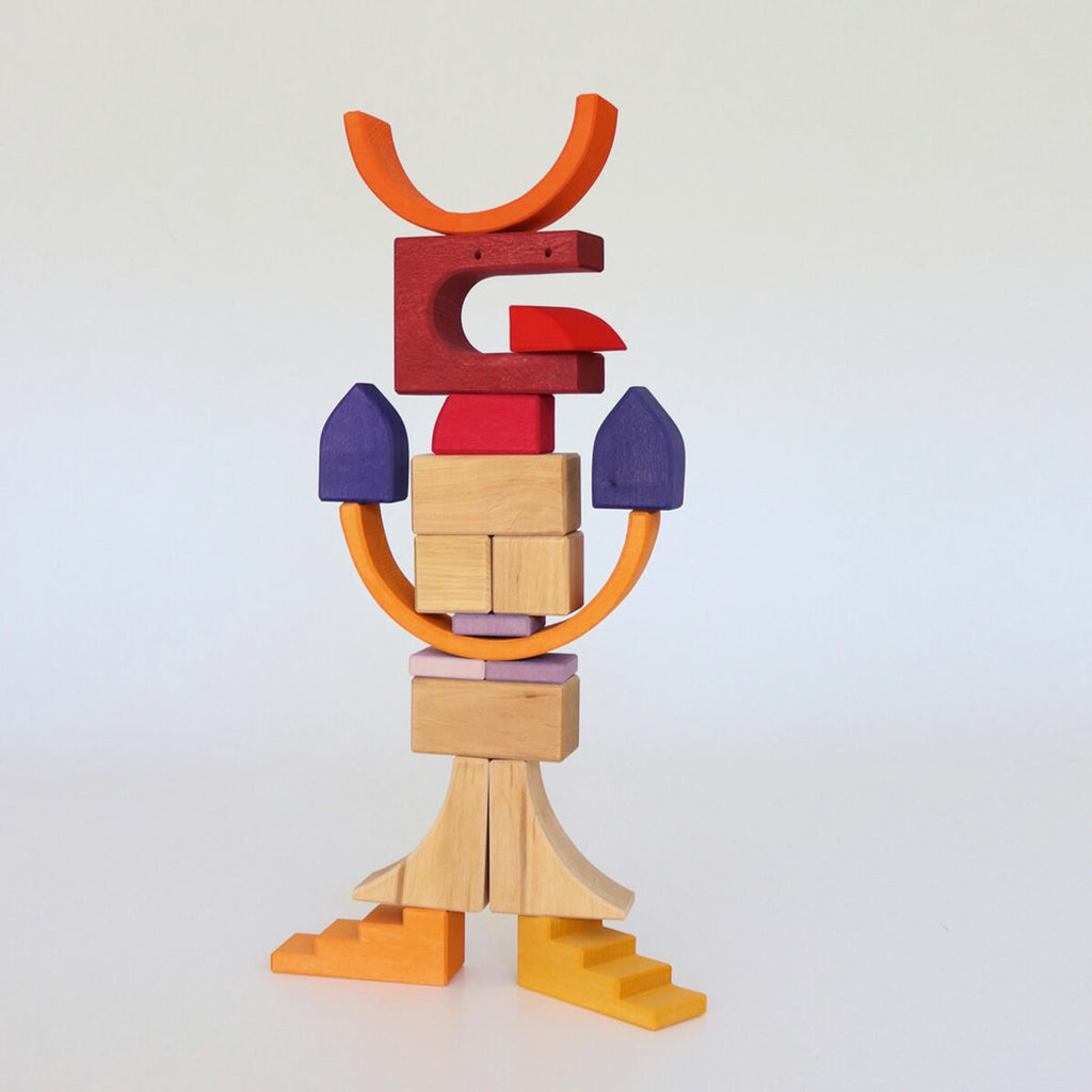 Colorful wooden block sculpture on a white background