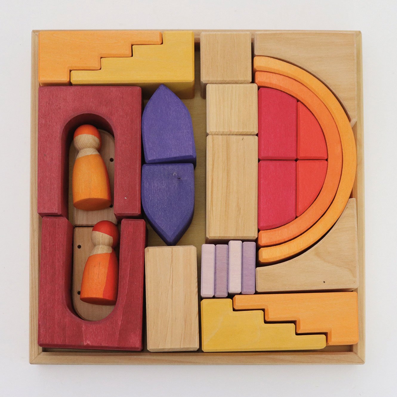 Colorful wooden building blocks set in a box on a white background
