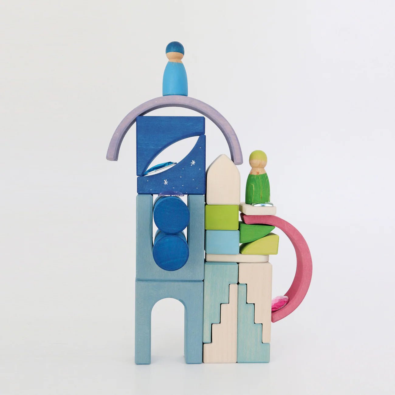 Colorful wooden toy blocks stacked on a white background