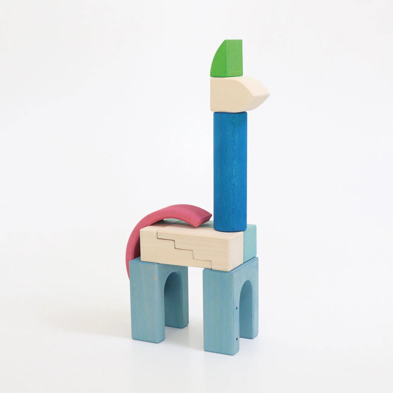 Colorful wooden toy blocks stacked on a white background