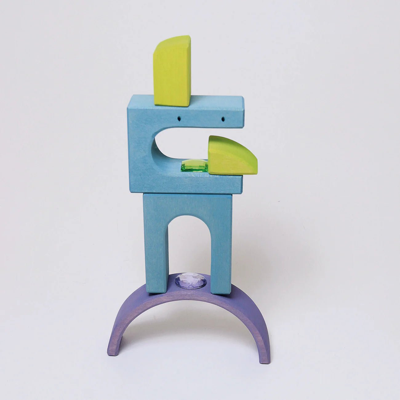 Colorful wooden toy structure with a white background