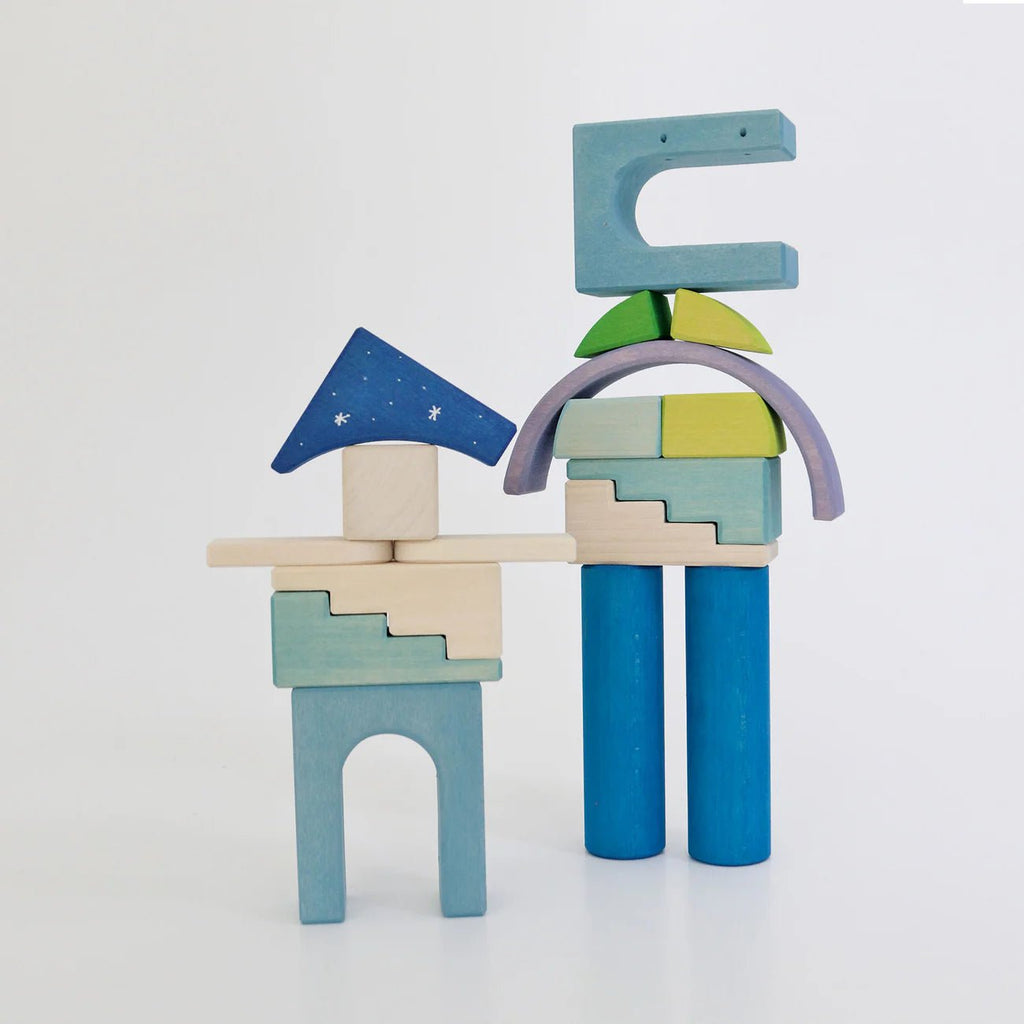 Colorful wooden block toys on a white background