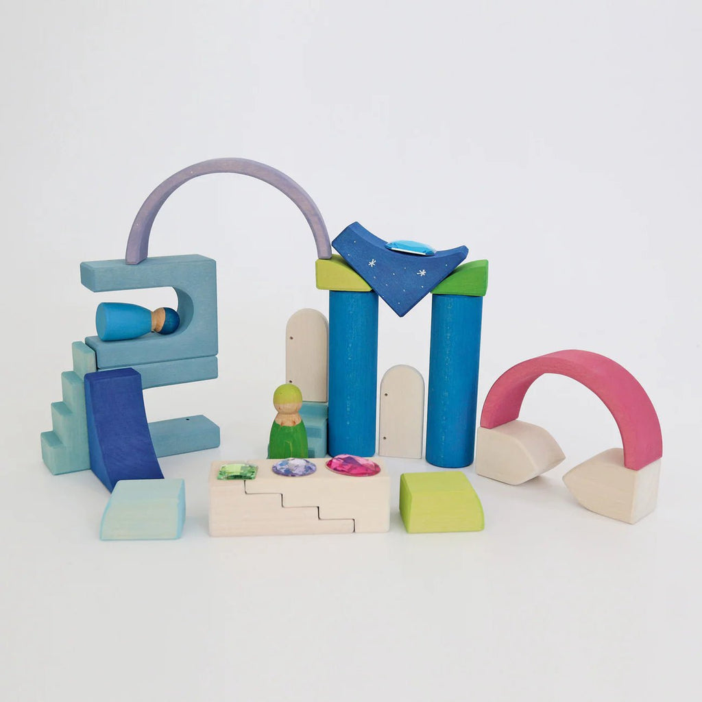 Colorful wooden toy set on a light gray background