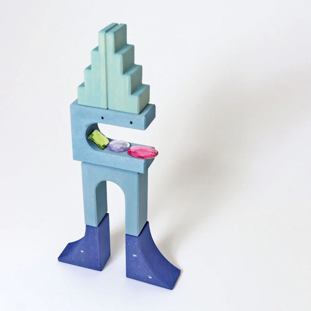 Colorful toy block structure on a white background