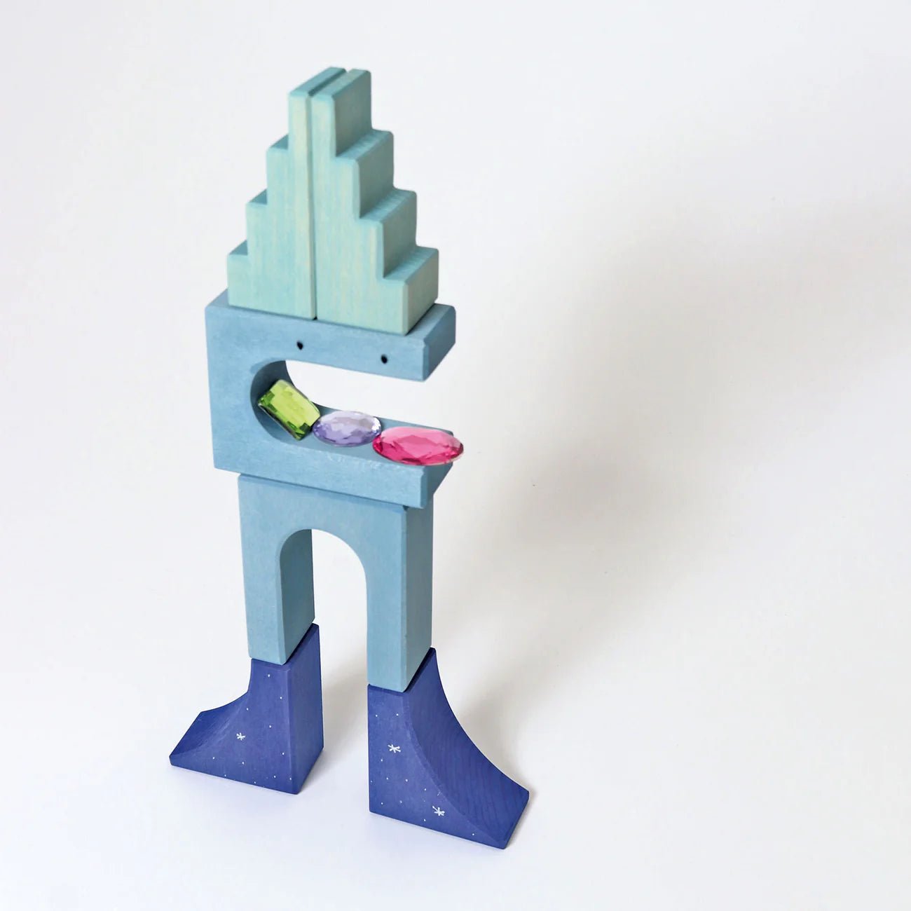 Colorful toy block structure on a white background
