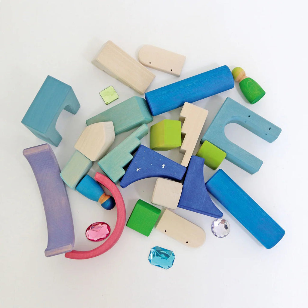 Colorful wooden blocks and geometric shapes on a white background