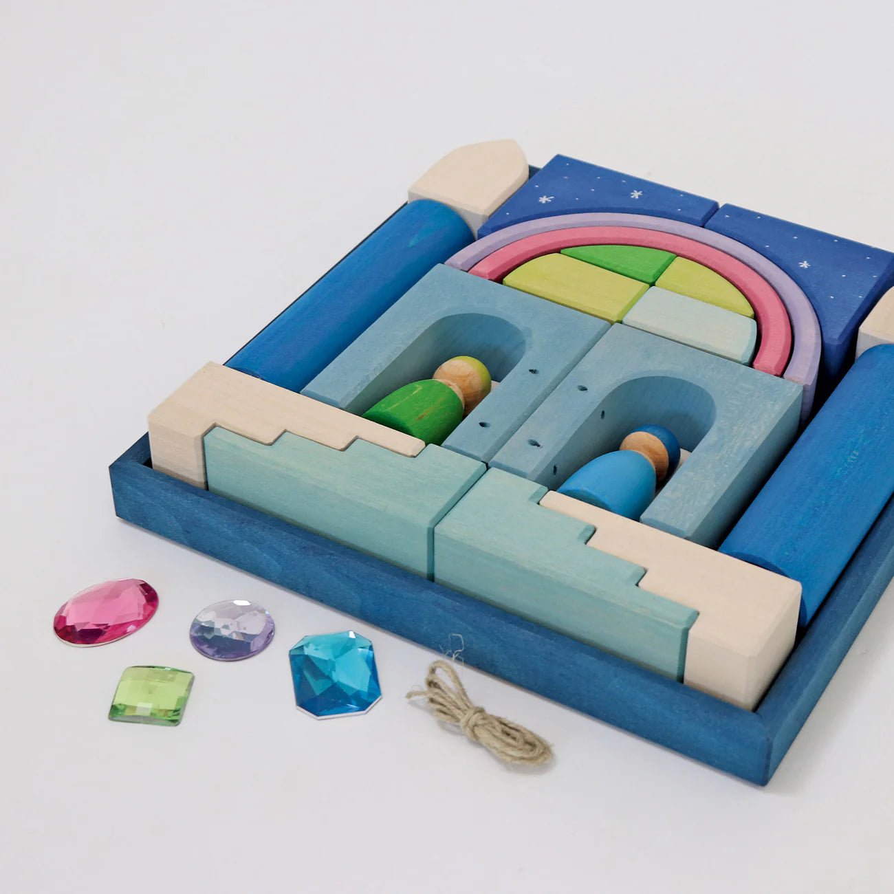 Colorful wooden puzzle toy with gems on a white background