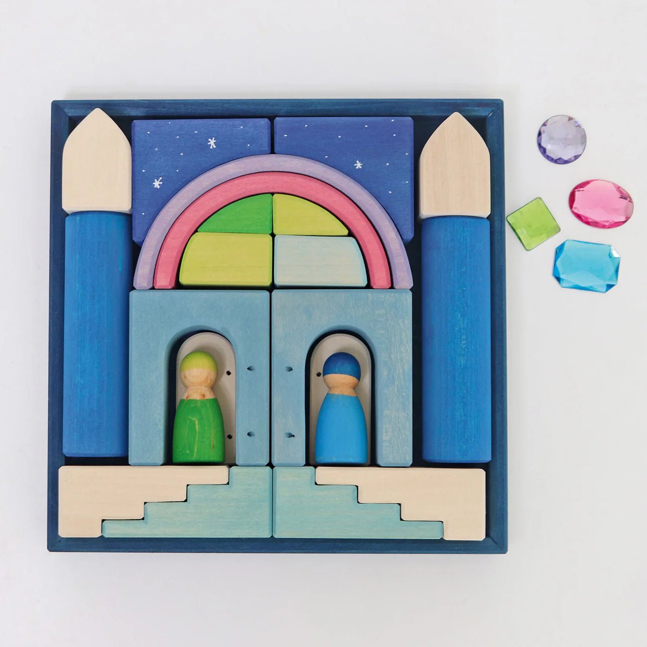 Wooden toy set with colorful blocks and figures in a blue box on a white background