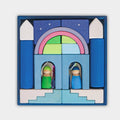 Wooden nativity set with colorful arch and stable in a blue box on a white background