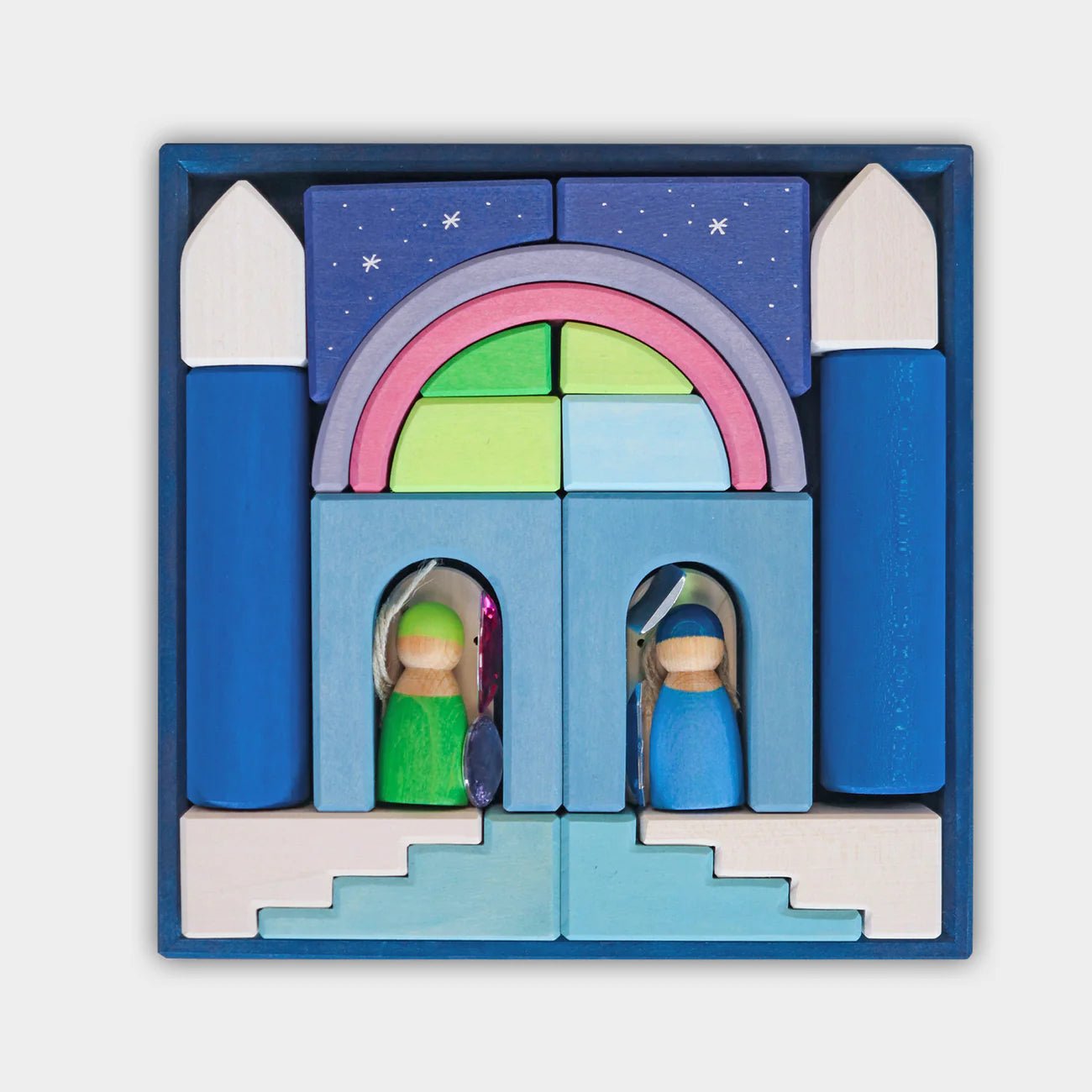 Wooden nativity set with colorful arch and stable in a blue box on a white background