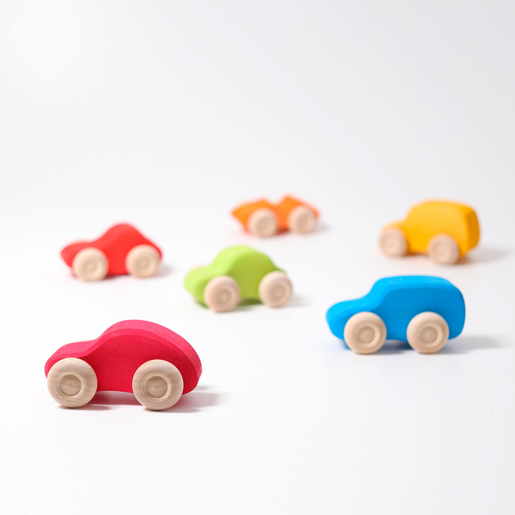 Colorful toy cars on a white background