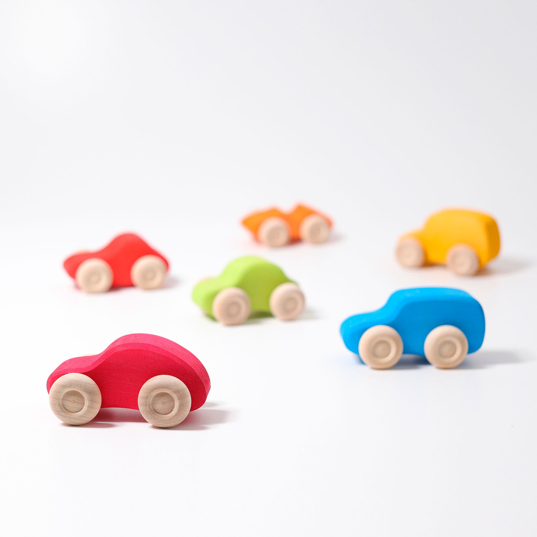 Colorful toy cars on a white background
