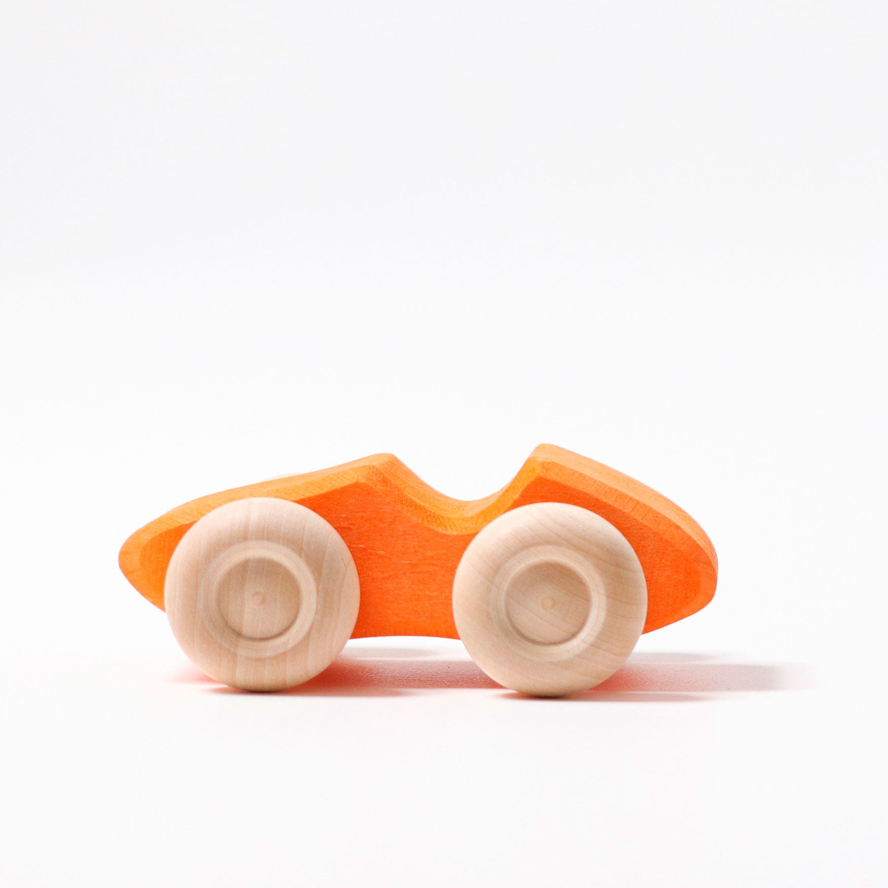 Wooden toy car with orange body and white wheels on a white background