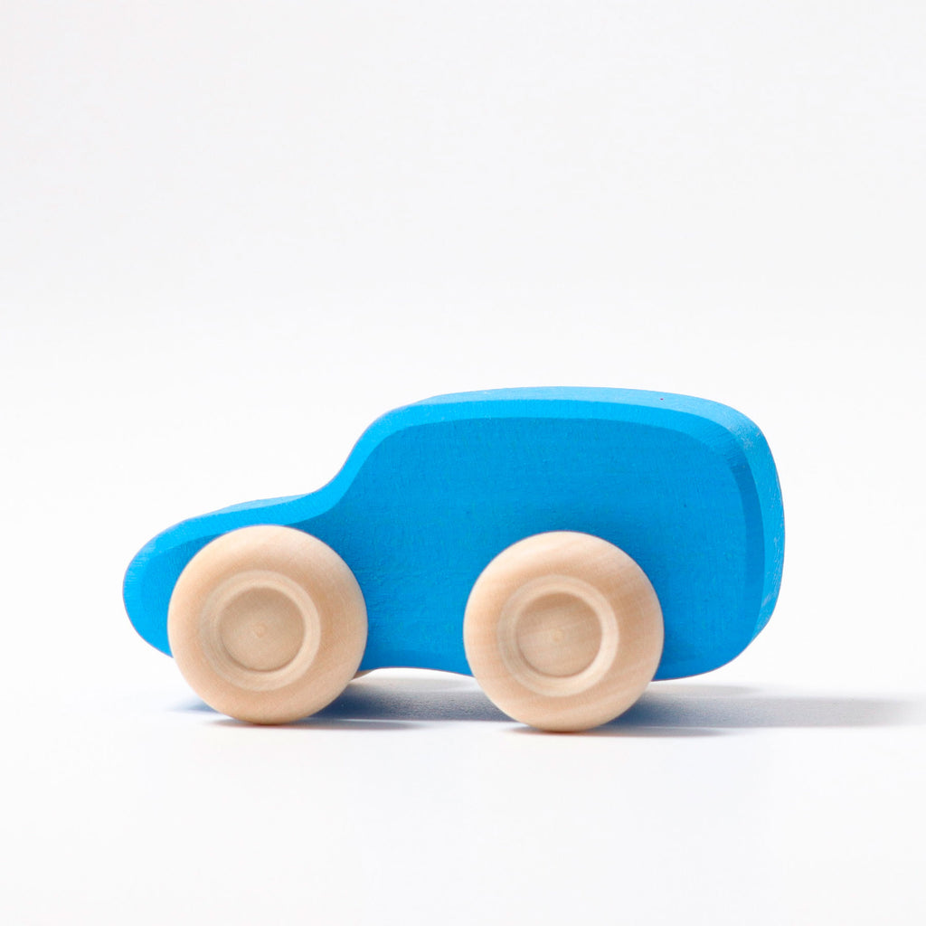 Blue toy car with beige wheels on a white background