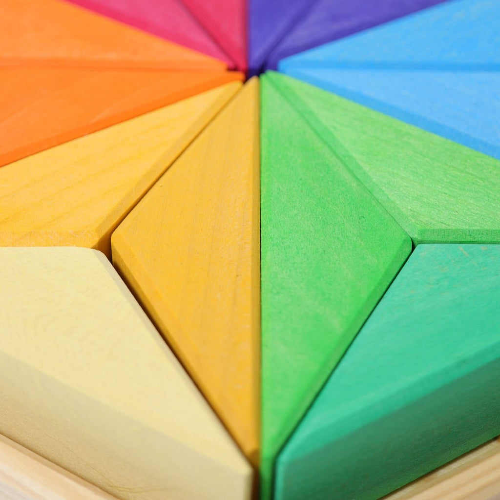 Colorful geometric foam tiles arranged in a circular pattern.