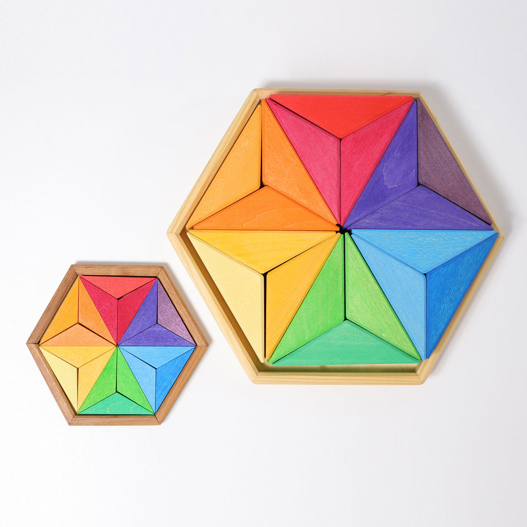 Two hexagonal wooden puzzles with colorful triangular pieces on a white background