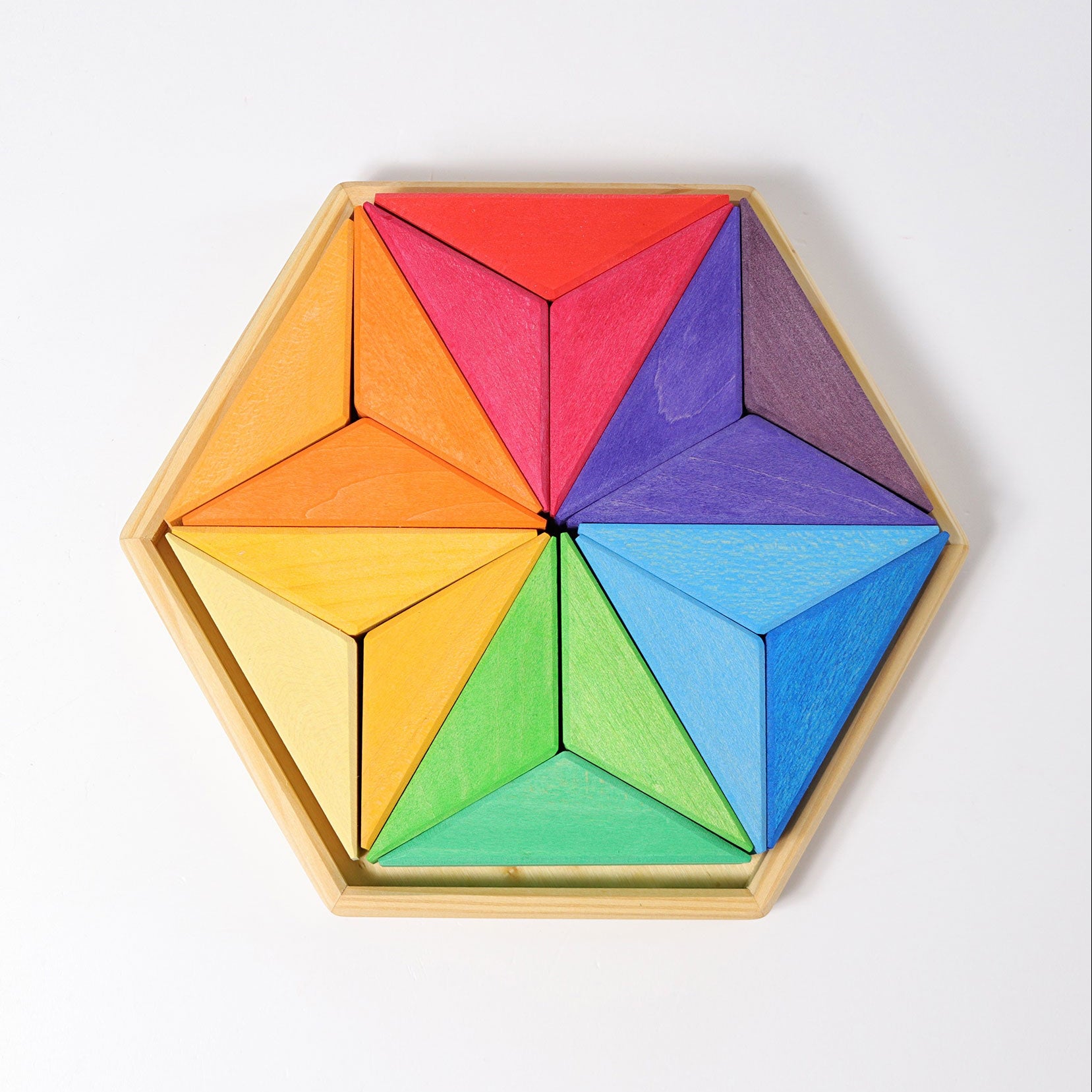 Colorful wooden tangram puzzle on a white background