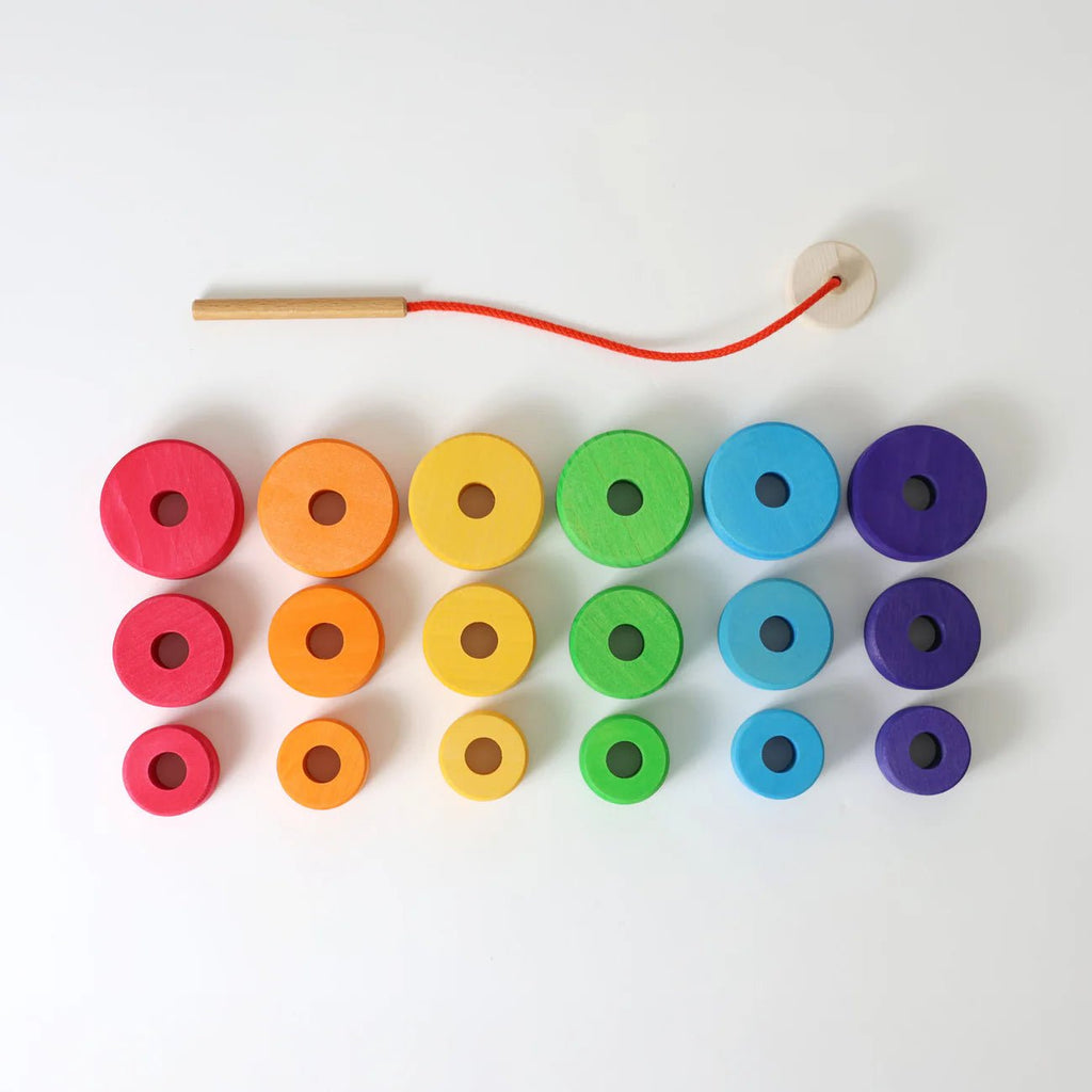 Colorful wooden beads on a white background