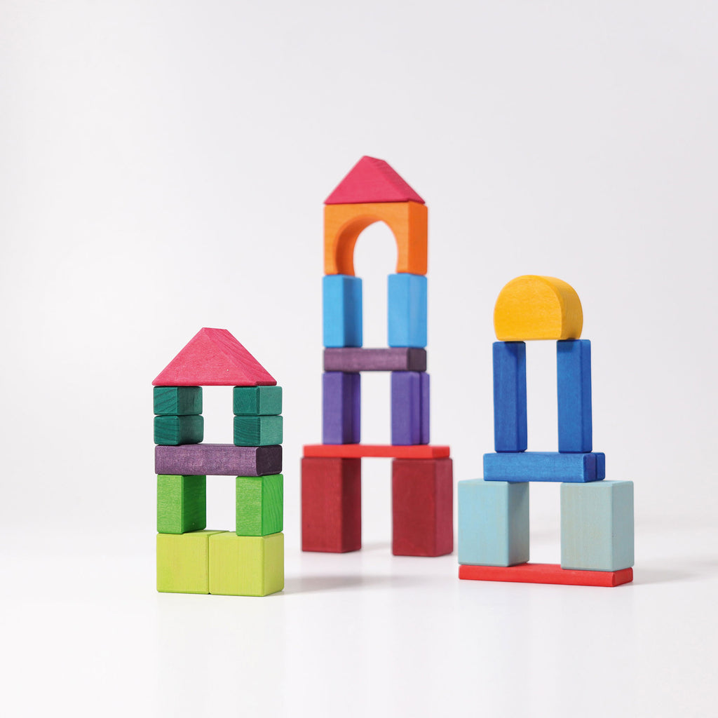 Colorful toy blocks stacked on a white background