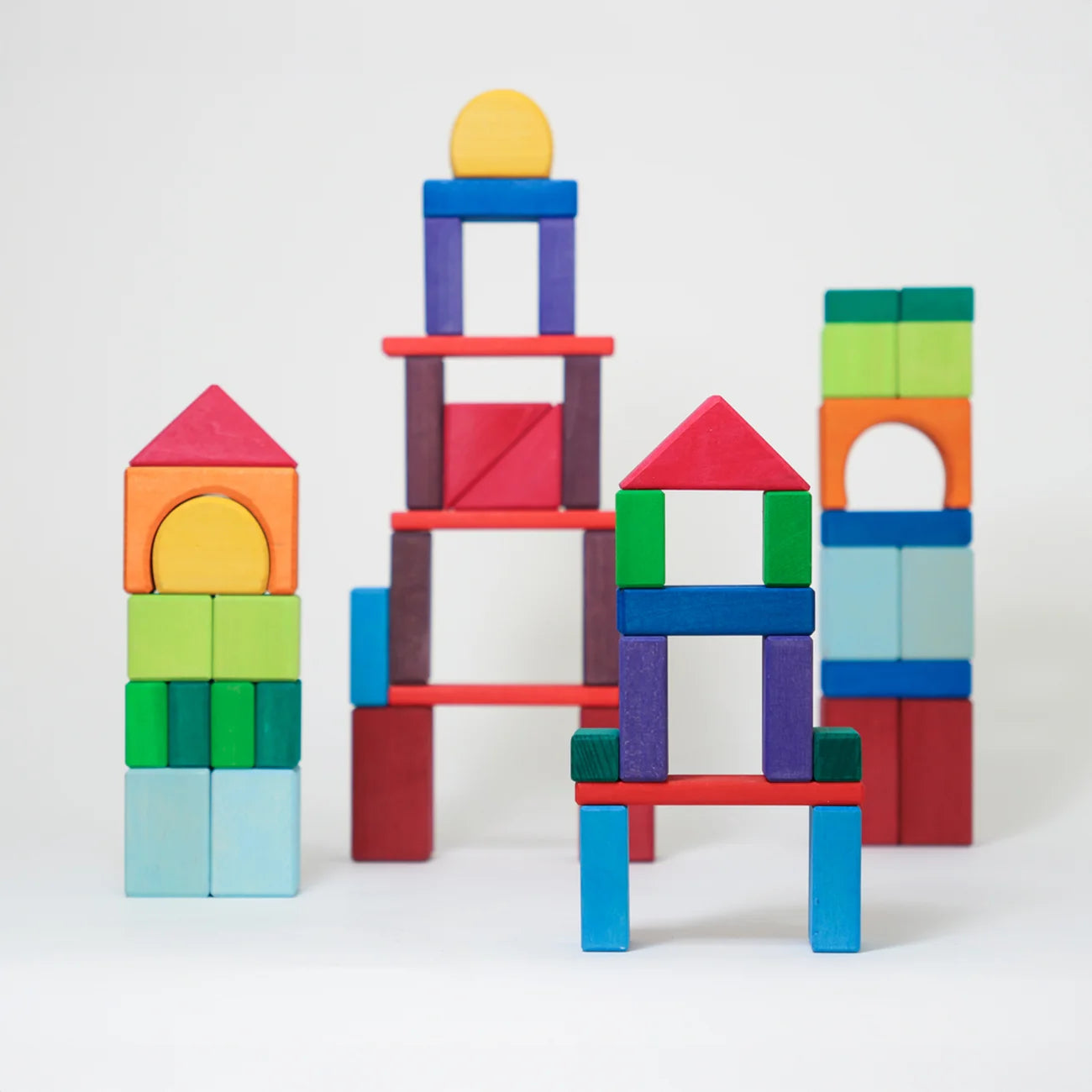 Colorful building blocks stacked on a white background