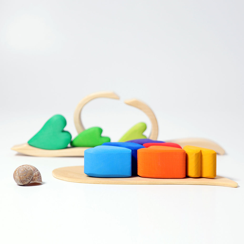 Colorful wooden toy with geometric shapes on a white background