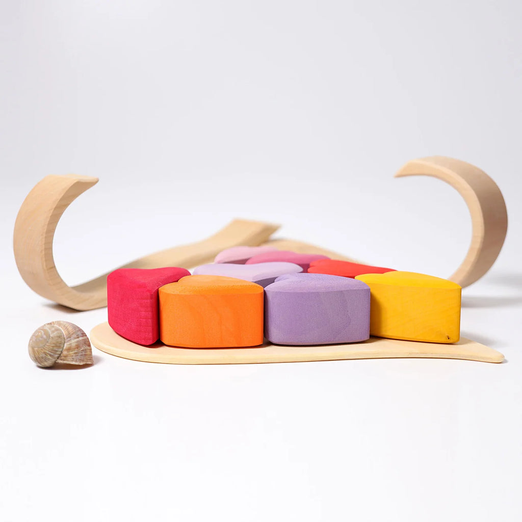 Colorful wooden toy with soft blocks on a white background