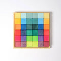 Set of colorful wooden blocks in a wooden frame on a white background