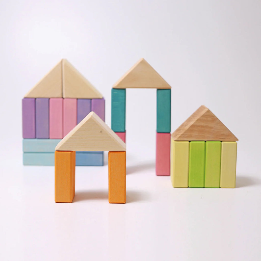 Colorful wooden block houses on a white background